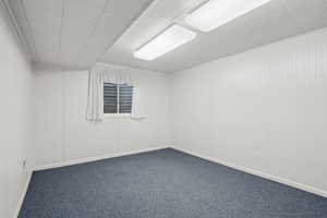 Empty room with carpet flooring