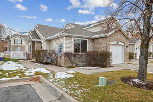 View of front of home featuring a garage and a front lawn