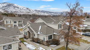 Snowy aerial view featuring a mountain view