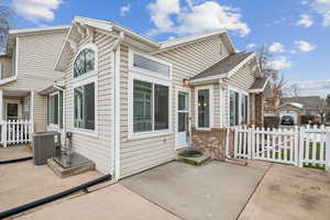 Exterior space with cooling unit and a patio