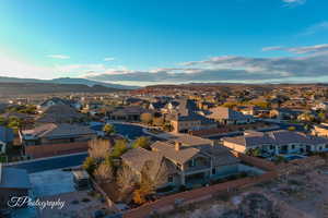 Birds eye view of property with a mountain view