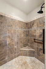 Bathroom featuring a tile shower