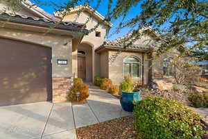 Entrance to property featuring a garage