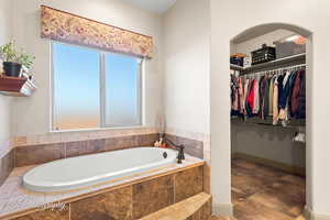 Bathroom with tiled tub