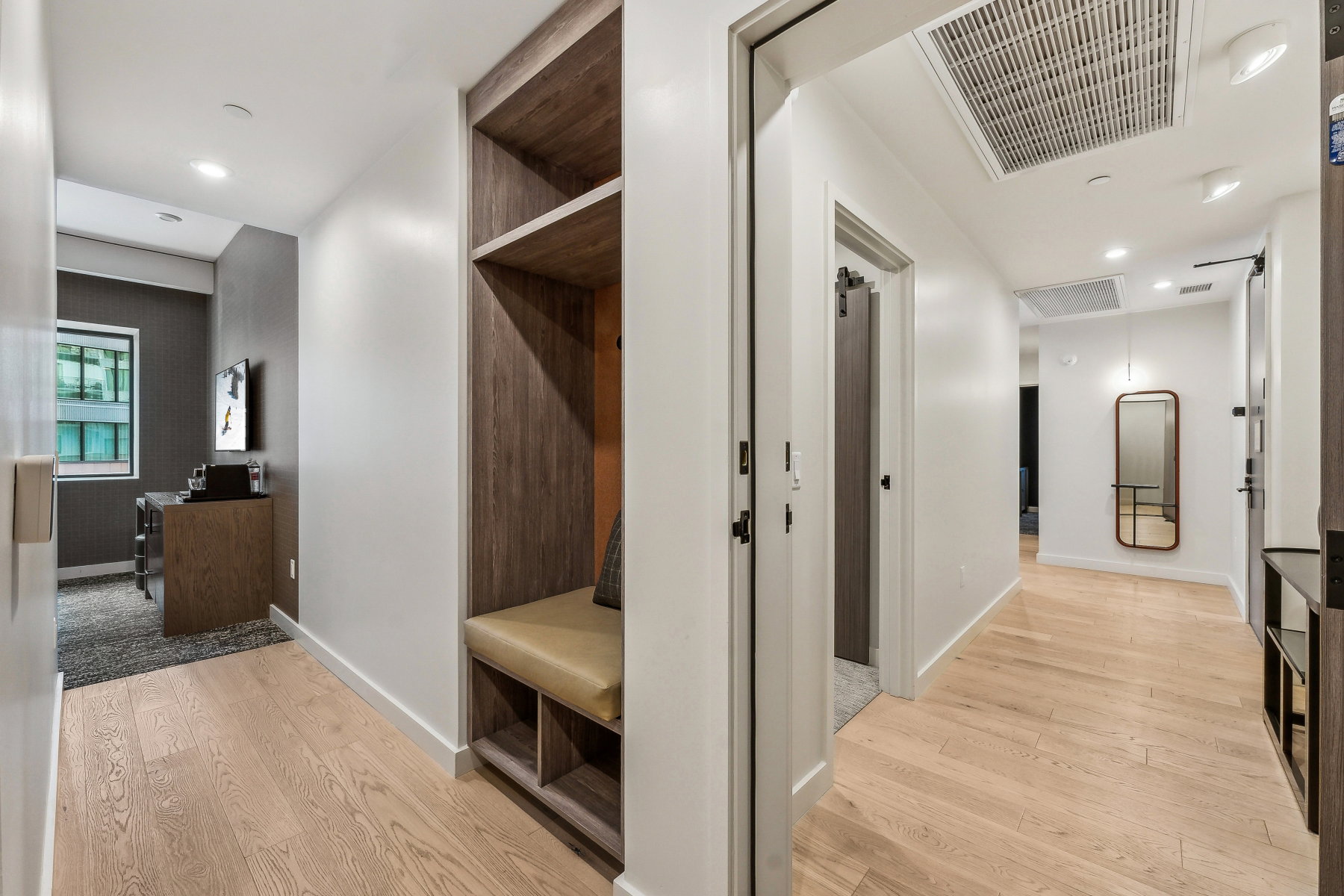 Mudroom with light hardwood / wood-style flooring