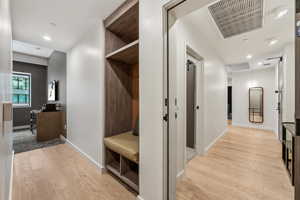 Mudroom with light hardwood / wood-style flooring