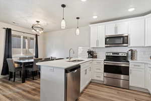 white cabinets, and sink