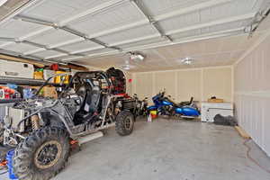 Garage featuring a garage door opener