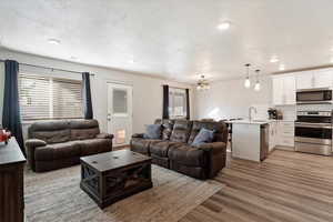 Living room featuring an open floor plan throughout the main living space