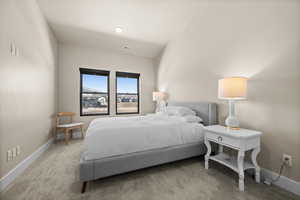Carpeted bedroom with visible vents and baseboards