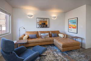 Living room with dark wood-type flooring