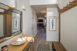 Interior space with hardwood / wood-style floors and a tiled fireplace