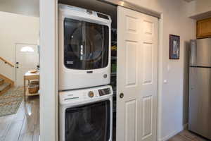 Laundry room featuring stacked washer / dryer