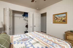 Bedroom with ceiling fan and a closet