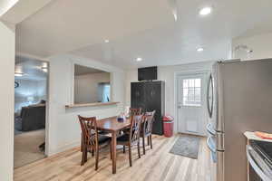 Dining space featuring light wood-type flooring