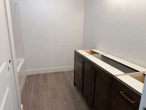 Bathroom featuring a washtub and hardwood / wood-style flooring