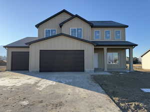 View of front of property featuring a garage