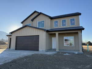 View of front of property with a garage