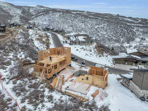 Snowy aerial view featuring a mountain view