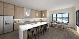 Kitchen with backsplash, stainless steel gas cooktop, an island with sink, fridge with ice dispenser, and wall chimney exhaust hood