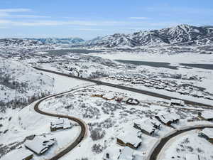 Snowy aerial view featuring a mountain view