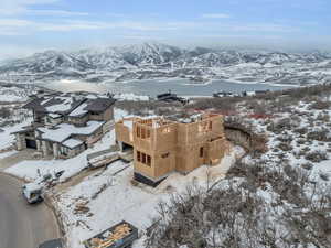 Snowy aerial view featuring a mountain view