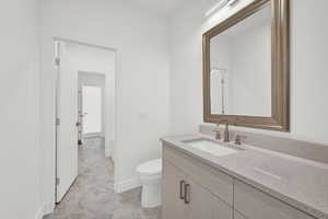 Bathroom with vanity and toilet