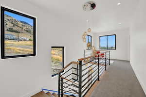 Stairway with carpet flooring and a mountain view