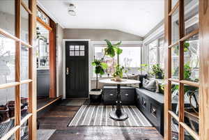 Sunroom with lofted ceiling and breakfast area