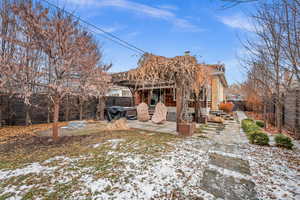 View of front of home featuring a patio