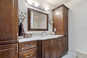 Bathroom featuring vanity and tile patterned flooring