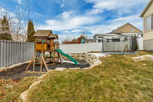 View of jungle gym with a yard