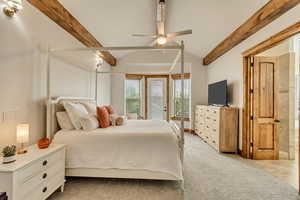 Bedroom featuring ceiling fan, light colored carpet, access to outside, and vaulted ceiling with beams