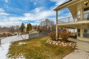 View of yard featuring a balcony