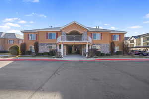 View of building exterior featuring a carport