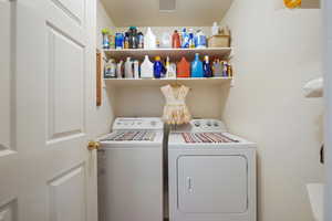 Laundry area with washer and clothes dryer