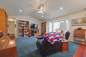 Living room featuring lofted ceiling