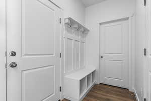 Mudroom with dark wood-type flooring