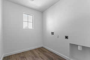 Washroom with laundry area, dark wood-type flooring, washer hookup, baseboards, and electric dryer hookup