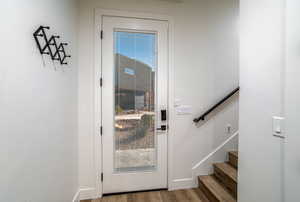 Doorway with light wood-type flooring