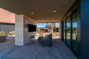 View of patio featuring a fireplace