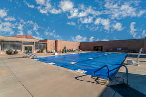 View of pool with a patio area