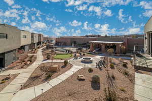 View of home's community featuring a patio and a fire pit