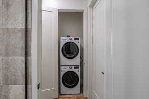 Laundry area featuring stacked washing maching and dryer