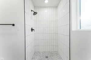 Bathroom featuring tiled shower