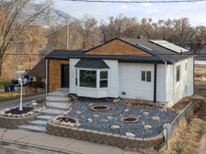 View of front of home with solar panels