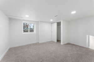 Unfurnished bedroom featuring a closet and carpet