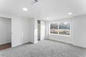 Unfurnished bedroom with carpet