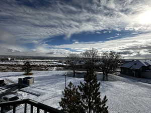 View of yard layered in snow