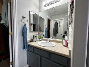 Bathroom with vanity and a textured ceiling